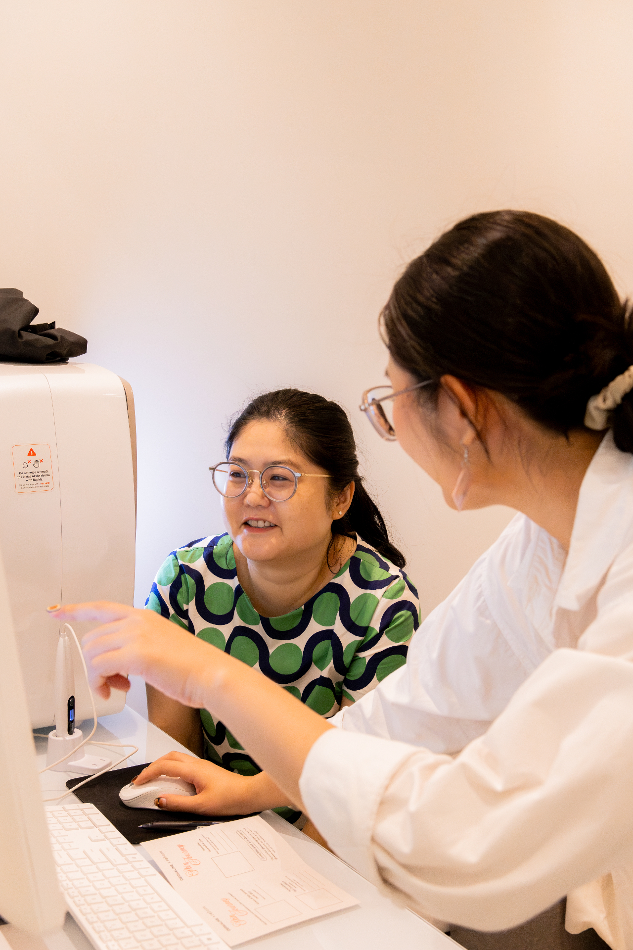 A person discussing skin assessment at Reborn Skin Clinic
