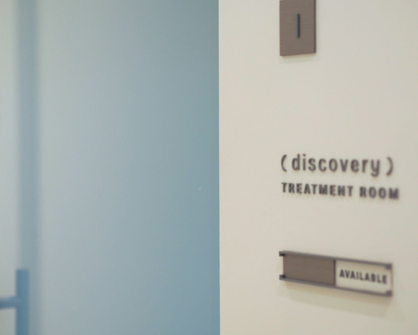 Treatment room signage inside Reborn Skin Clinic